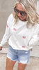 Patriotic crew neck sweater with flag and bows design and jean shorts.