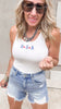 Casual Fourth of July look with USA bodysuit and denim cutoffs.