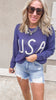 Classic USA lettered sweater in navy with high-rise cutoff shorts.
