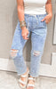 Casual washed denim joggers with elastic waist and knee rips.