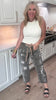 Washed leopard print pants with distressed details and relaxed fit.

