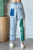 Vintage wash jeans featuring bold patchwork details and relaxed fit.