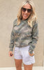 Casual grey fleece lounge shorts with adjustable waist tie and relaxed fit, styled with a camouflage pullover.