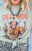Person wearing a shirt with a bull graphic and 'DEJA MOO' text.