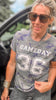 Woman wearing a 'GAMEDAY 36' t-shirt outdoors.