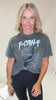 Woman wearing a graphic t-shirt with text and a bird design.