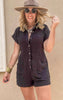 Lightweight black romper with short sleeves and a flattering button-up design.