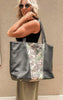 Styled travel look featuring a camo and black Makeup Junkie weekender tote, paired with a black tank and flowy olive pants.