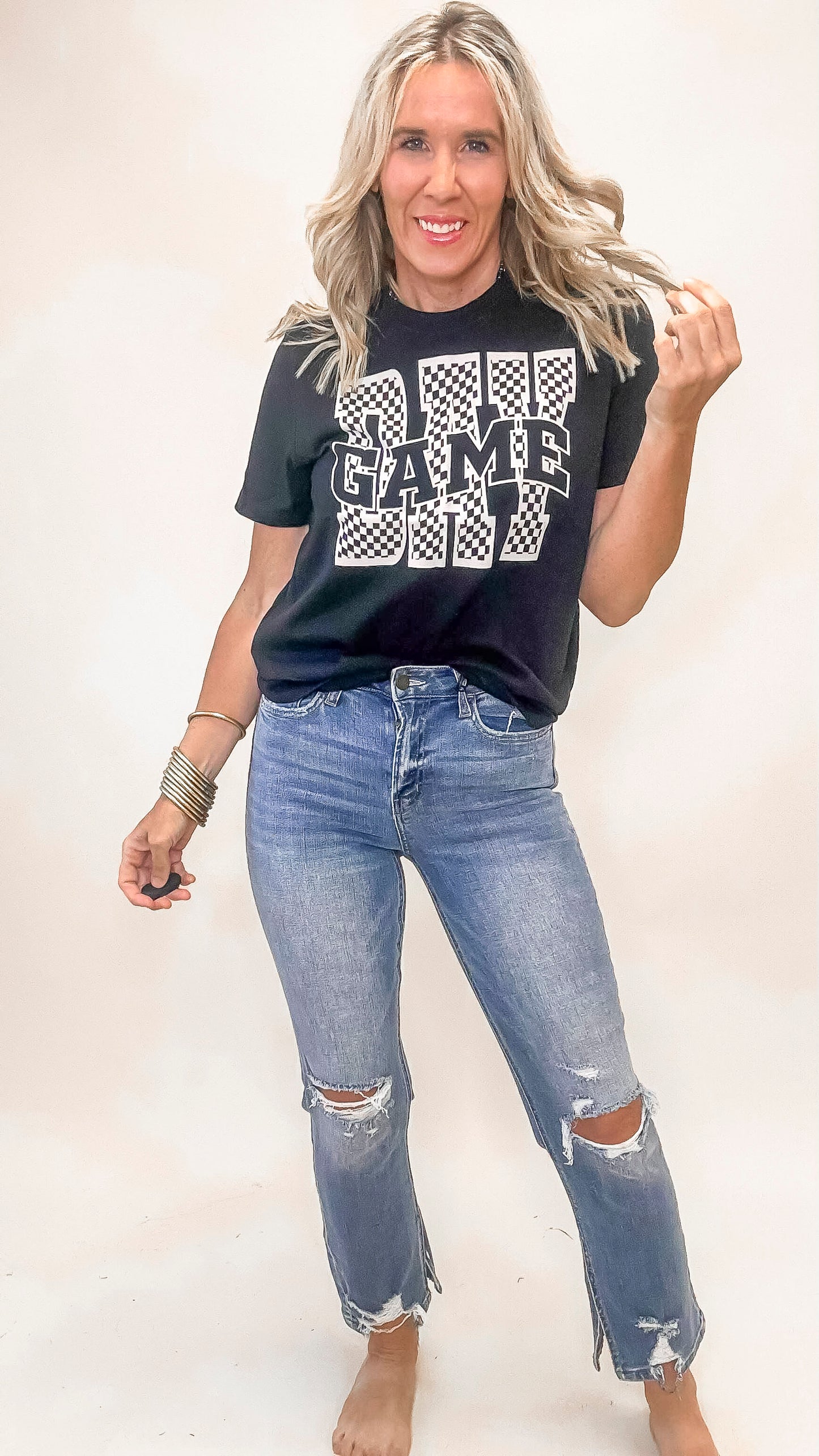 Short sleeve black t-shirt featuring Game Day print, perfect for football season