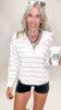 White and black striped mock neck pullover with zip-up detail and relaxed fit for casual-chic style.