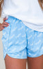 Light blue shorts with 'Baseball' print worn by a person against a neutral background