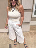 Casual summer outfit with white drawstring gauze pants and sleeveless tank.
