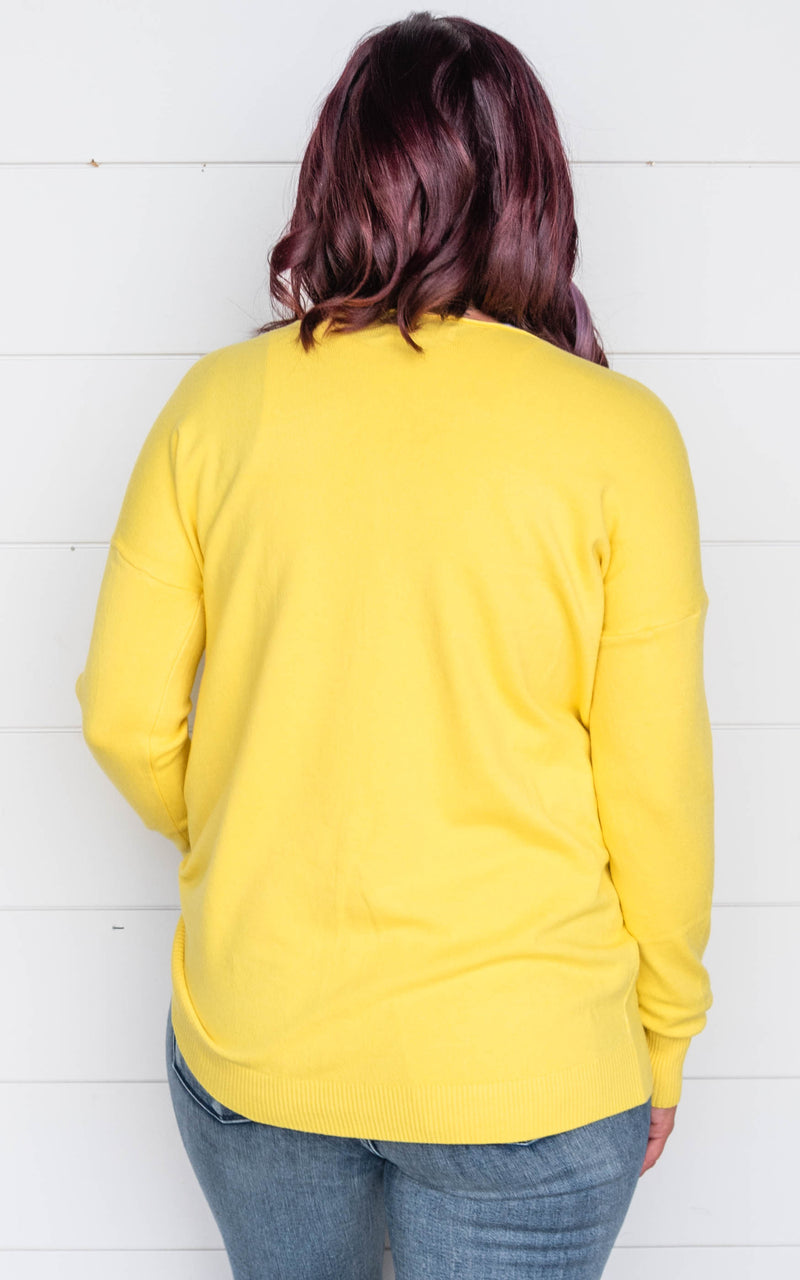 yellow sweater 