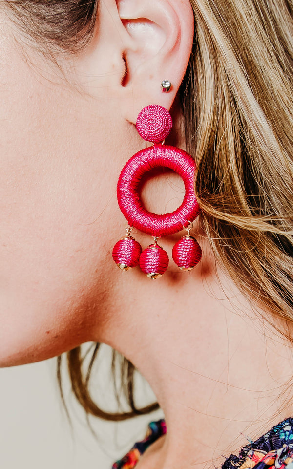 fuschia yarn circle earring 