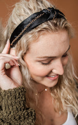black headband with gold chain detail